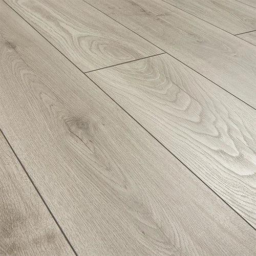 Silver oak laminate flooring planks with natural wood grain texture, close-up view