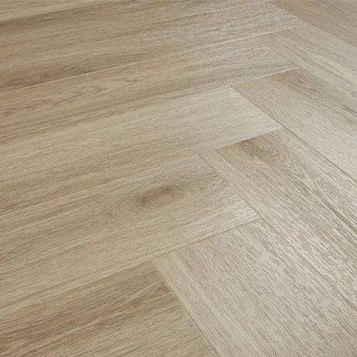 Light oak effect herringbone laminate flooring with wood grain texture