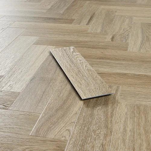 Smoky oak vinyl flooring plank on herringbone pattern floor, light wood grain texture