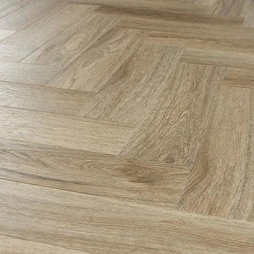 Smoky oak wood flooring with herringbone pattern and textured grain detail