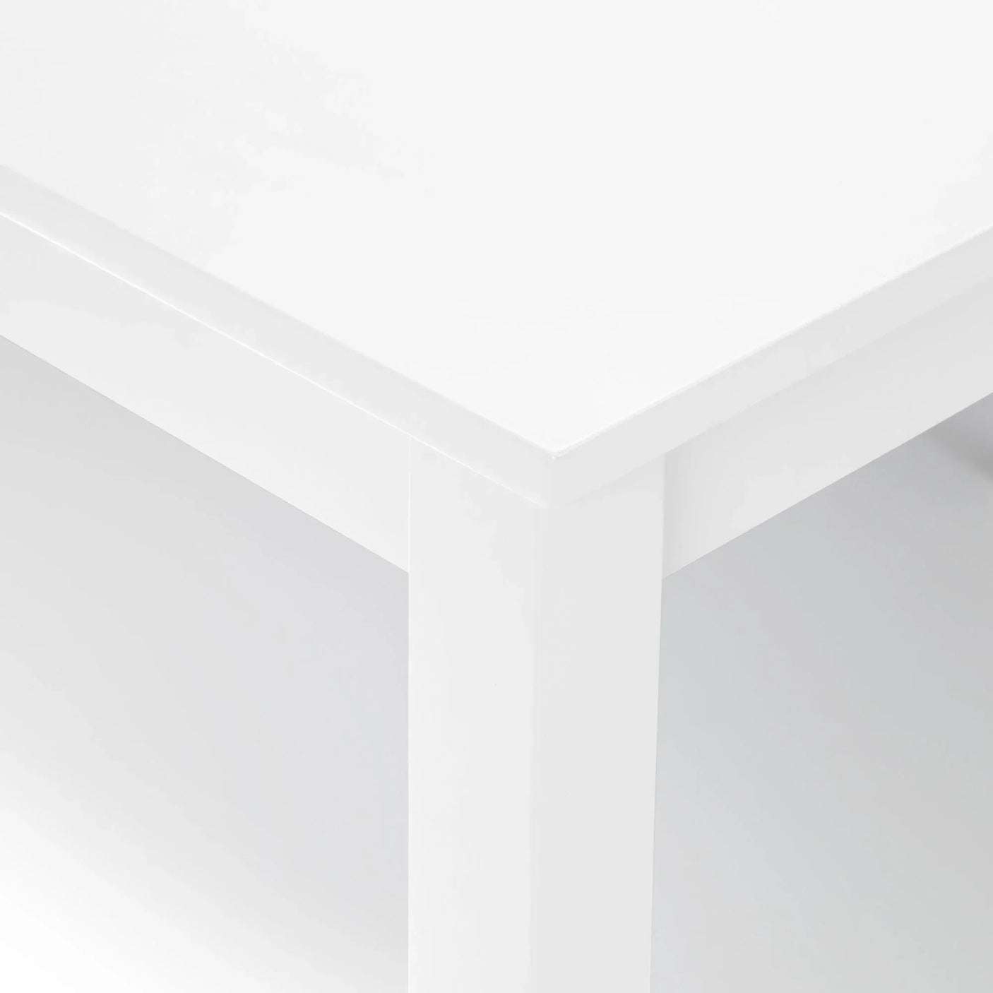 White dining table corner with clean lines and smooth finish