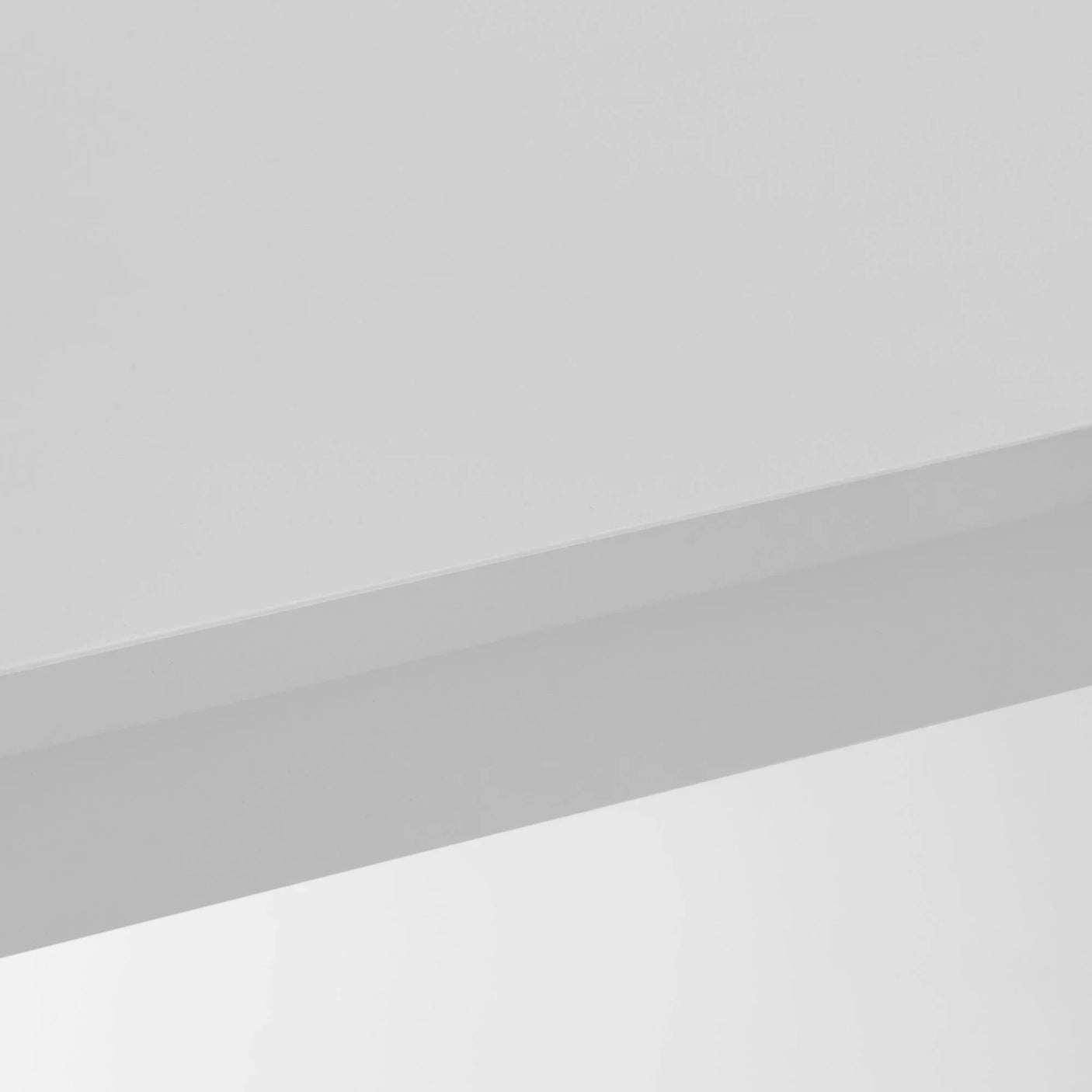 White gloss table corner showing smooth surface and clean straight edge