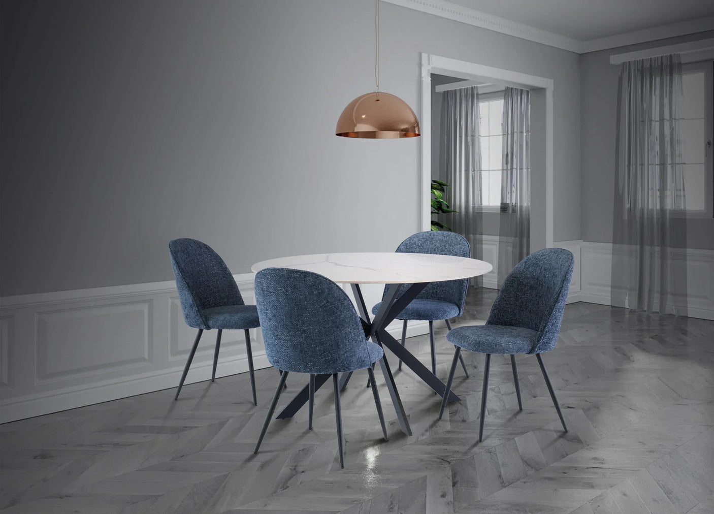 Round marble dining table with blue fabric chairs in modern grey dining room