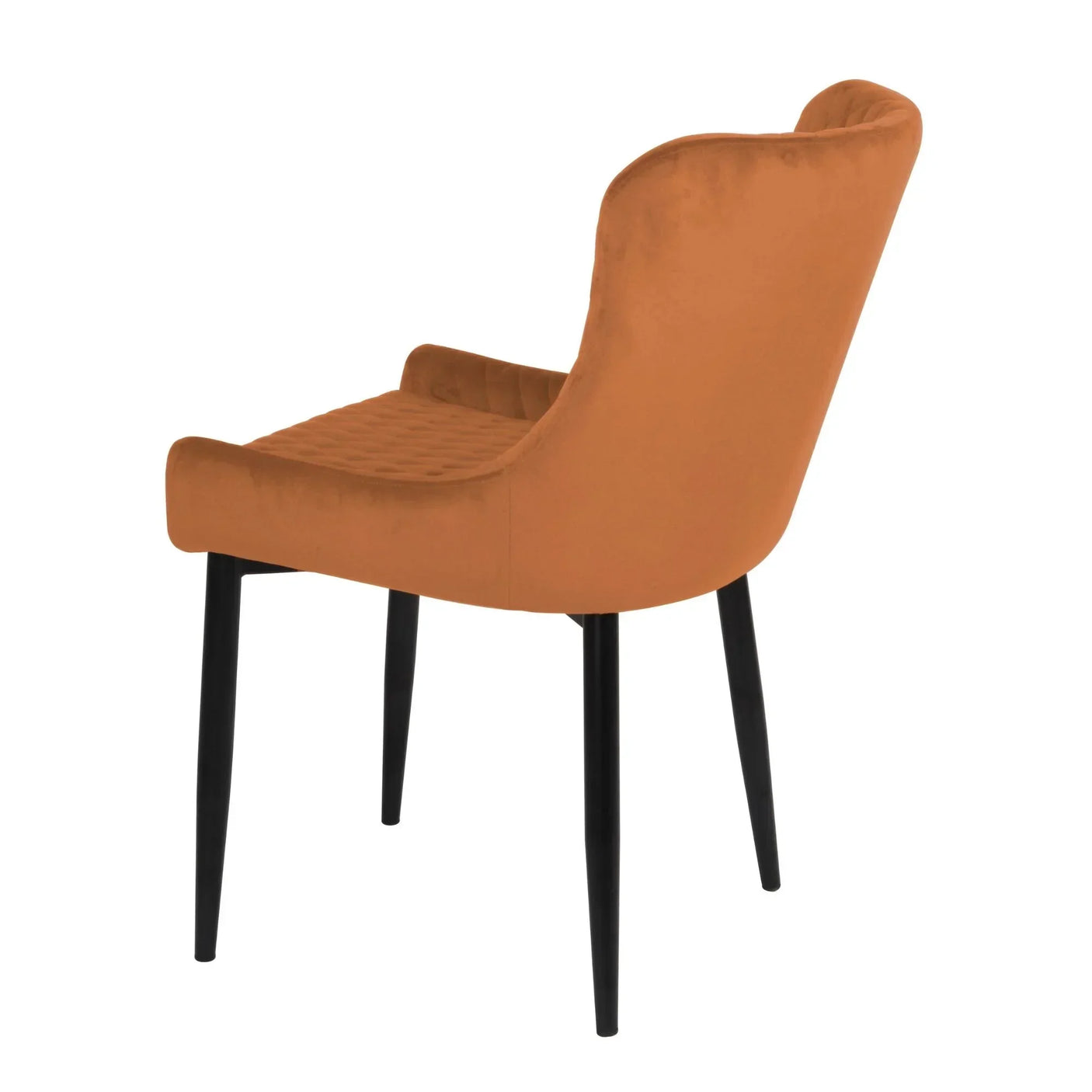 Orange velvet dining chair with black legs, rear angled view