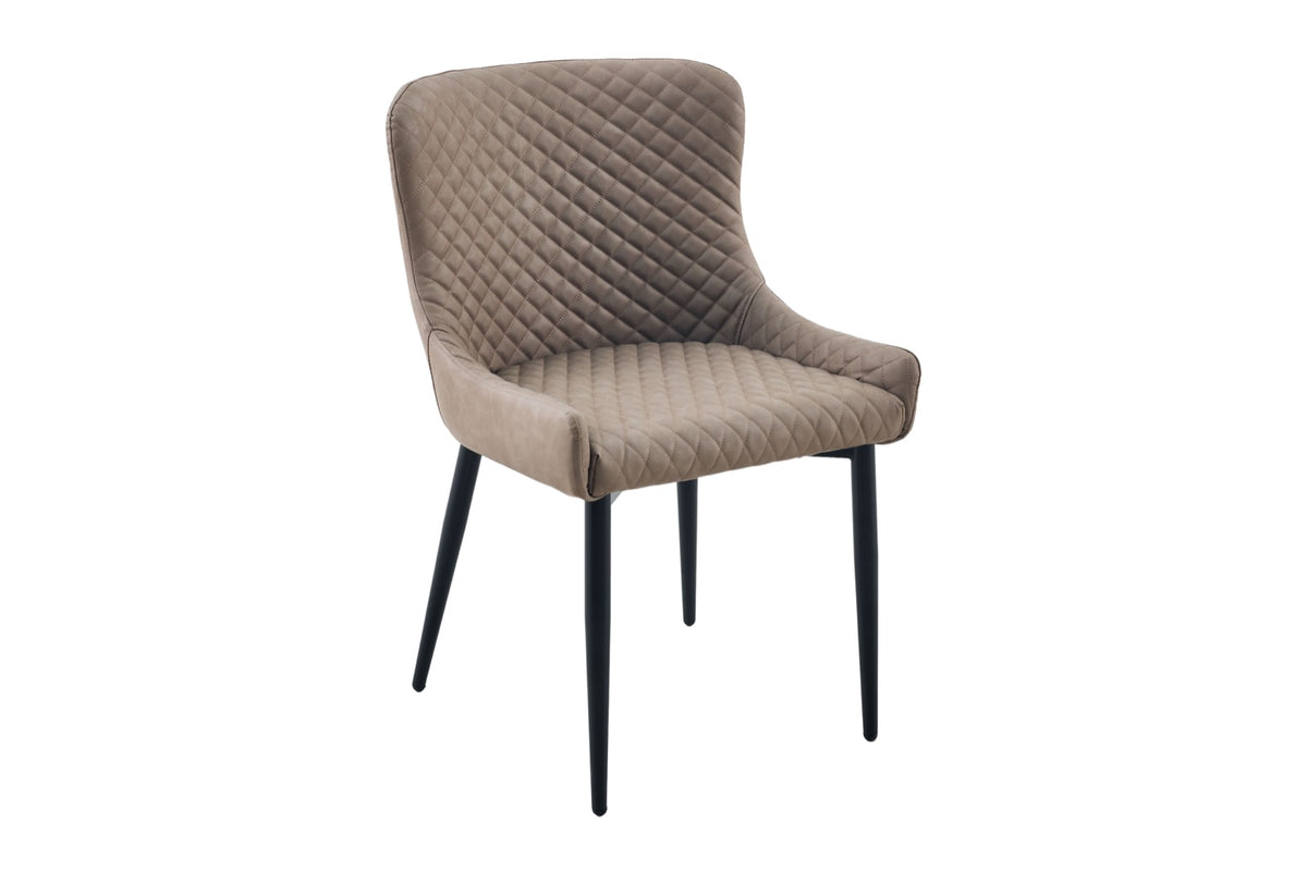 A modern dining chair upholstered in taupe quilted velvet with slim black metal legs, shown against a plain white background.