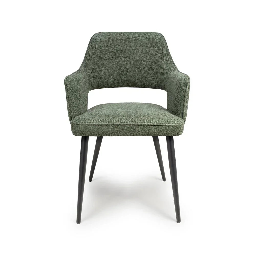 Green fabric dining chair with armrests and black tapered metal legs, front angle view