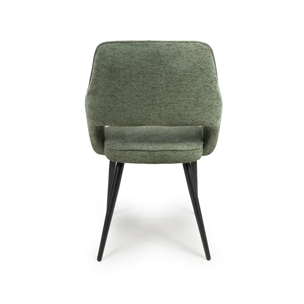 Green fabric dining chair with curved backrest and black angled legs, rear view