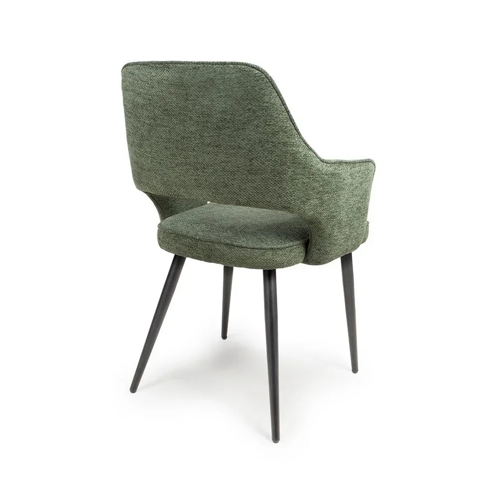 Green upholstered dining chair with black legs, rear angle view