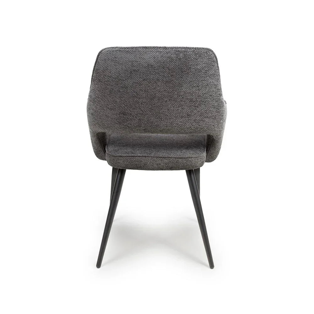 Grey fabric dining chair rear view with black tapered legs