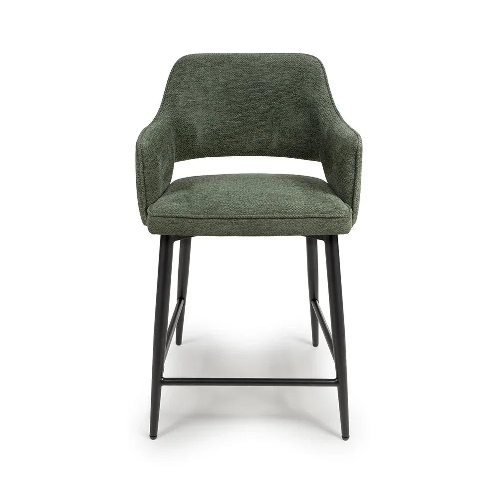 Green fabric bar stool with armrests and black metal legs, front view