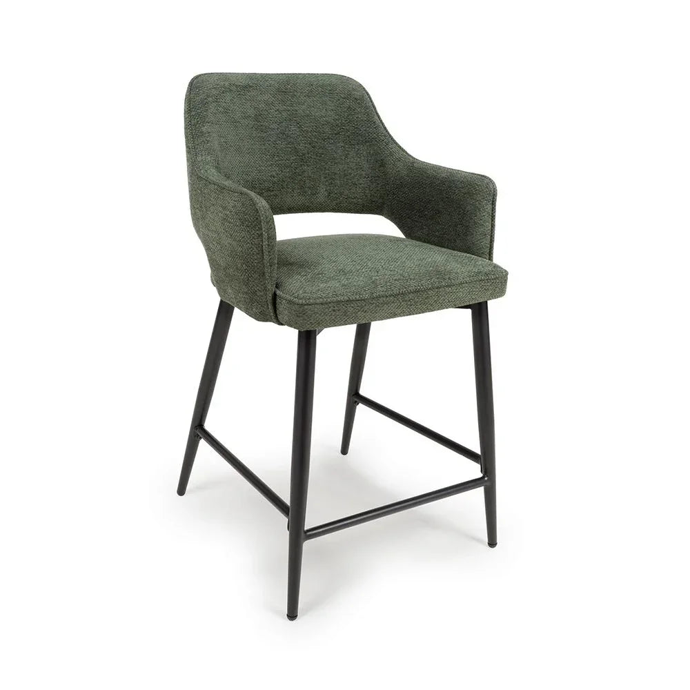 Green fabric bar stool with curved backrest and black metal legs