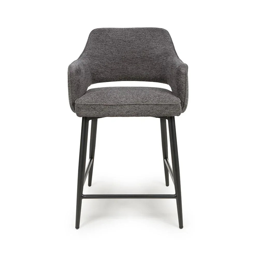 Grey fabric bar stool with armrests and black metal legs, front view