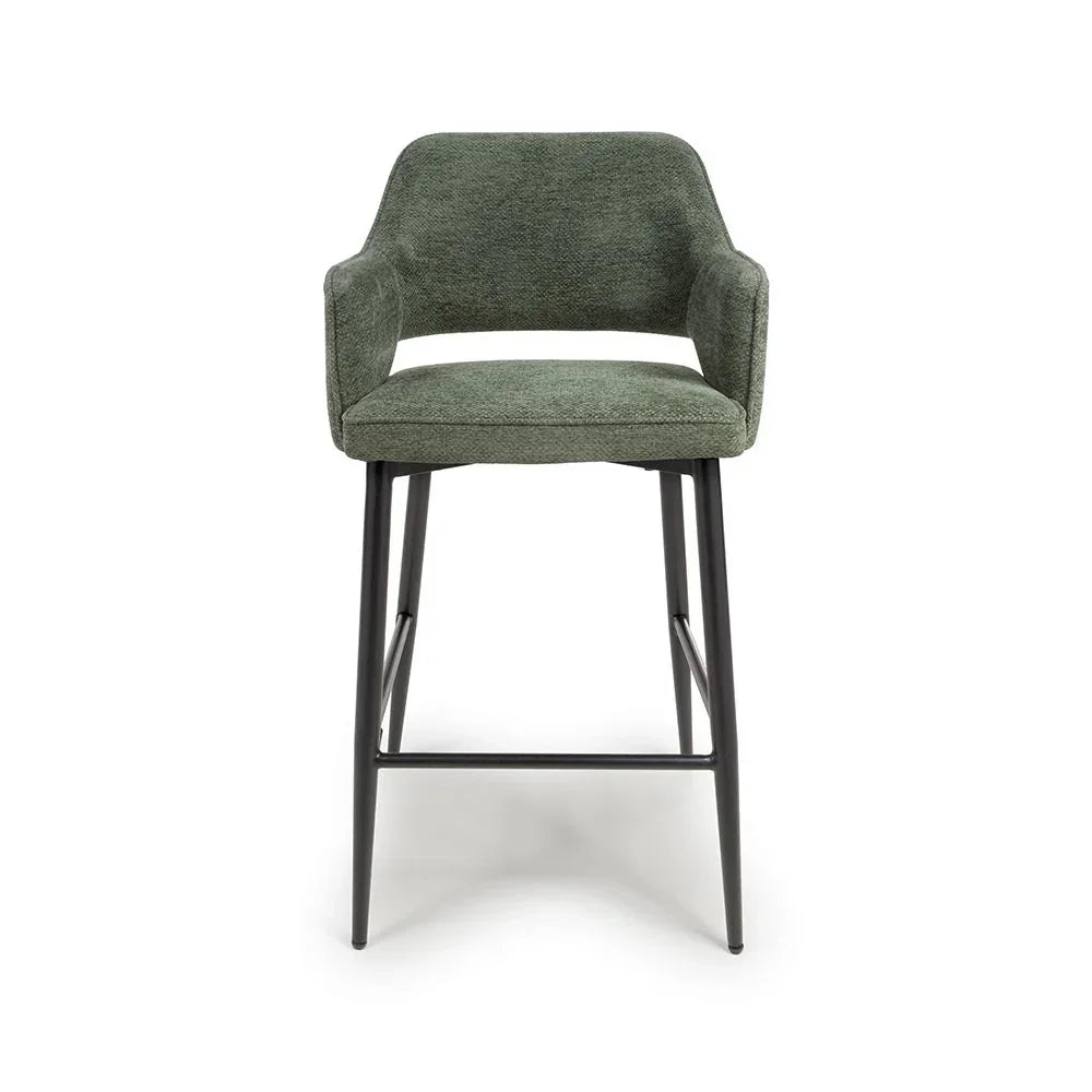 Green fabric bar stool with black metal legs and low backrest, front facing view