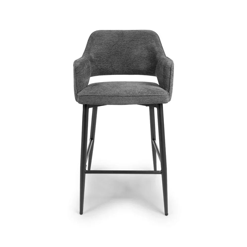 Grey fabric bar stool with armrests and black metal legs front view