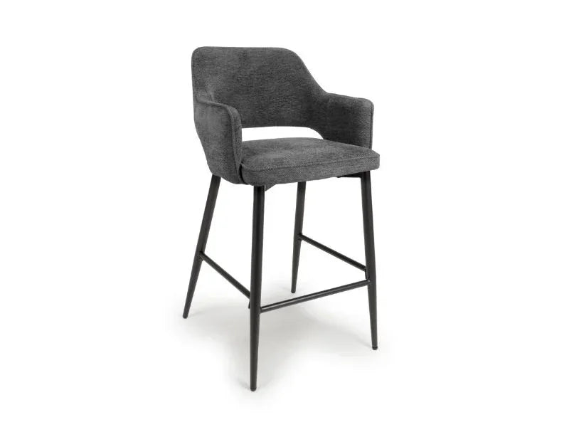 Grey fabric bar stool with armrests and black metal legs on white background