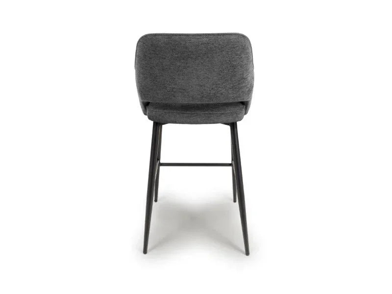 Grey fabric bar stool with metal legs, rear view