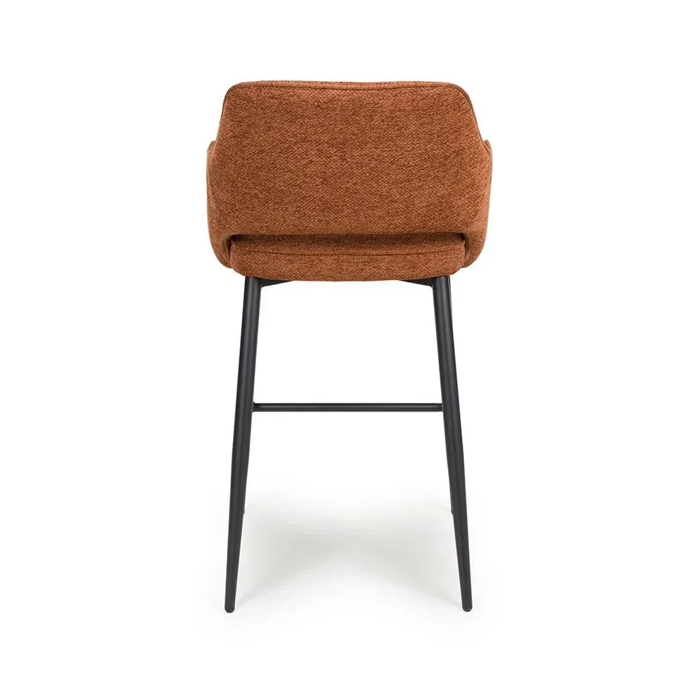 Rust fabric bar stool with black metal legs, rear view