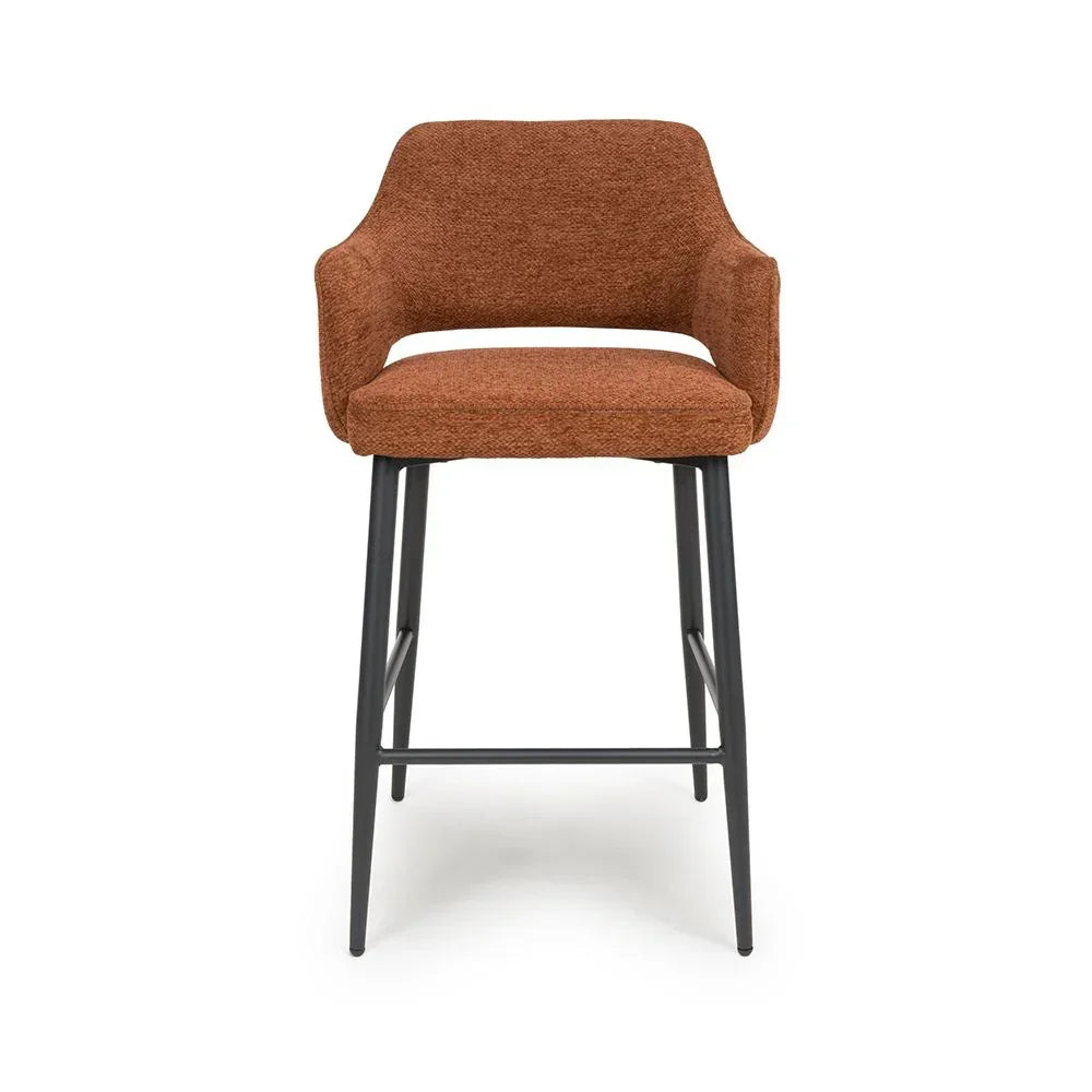 Brown fabric bar stool with curved backrest and black metal legs, front view