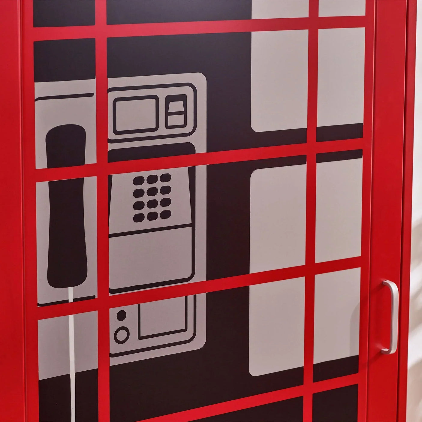 Red telephone box wardrobe close-up showing printed phone and keypad detail on door panel