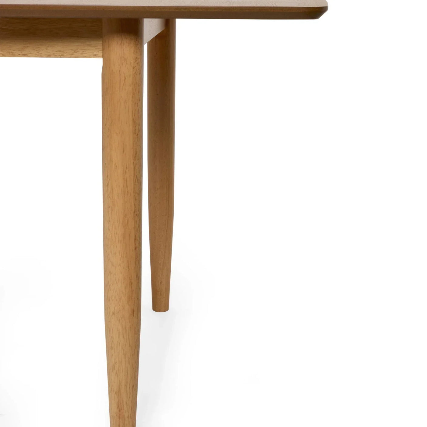 Light wood dining table corner with rounded edge and tapered legs