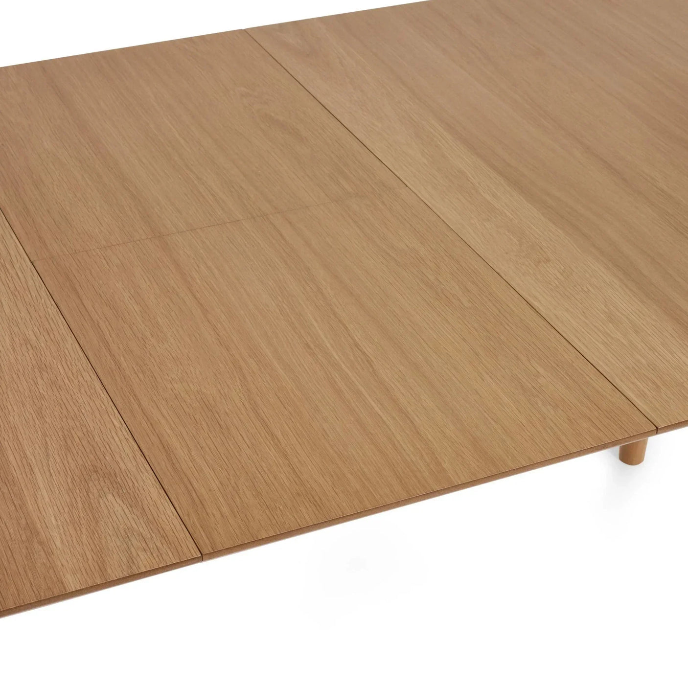 Light oak dining table top with visible grain and extension leaf seam