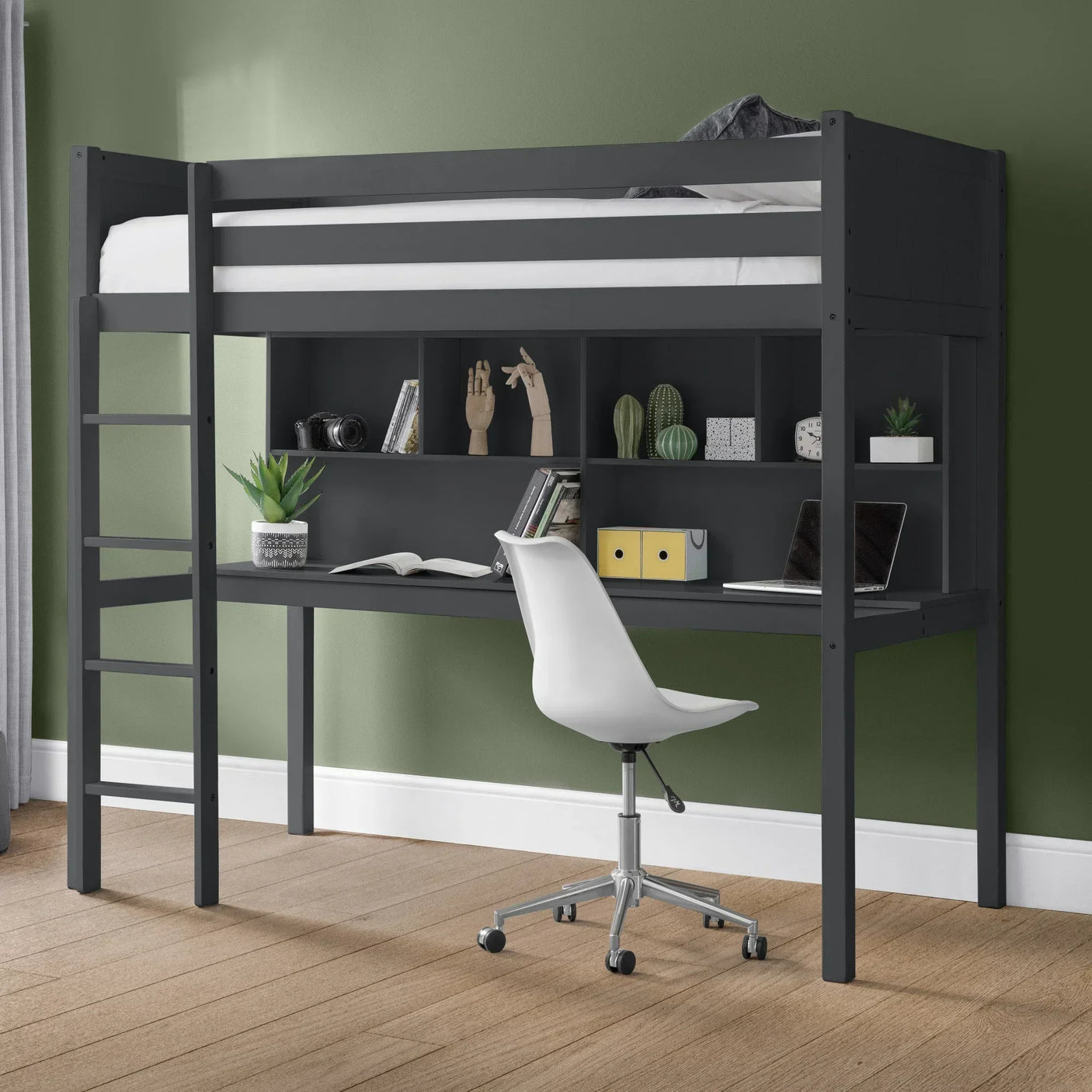 Black loft bed with built-in desk, shelves, and white office chair in modern bedroom