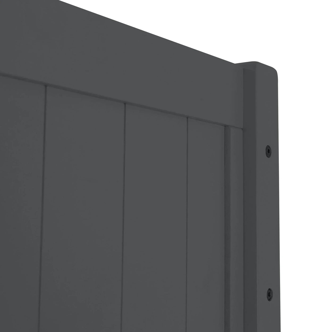 Closeup of dark grey wooden bed frame headboard with vertical panel design