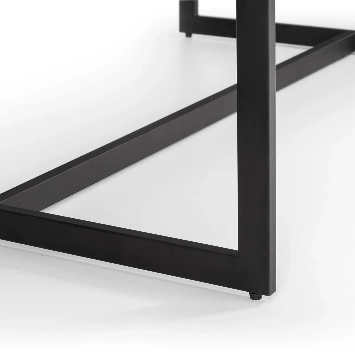 Close-up of black metal table leg frame corner joint