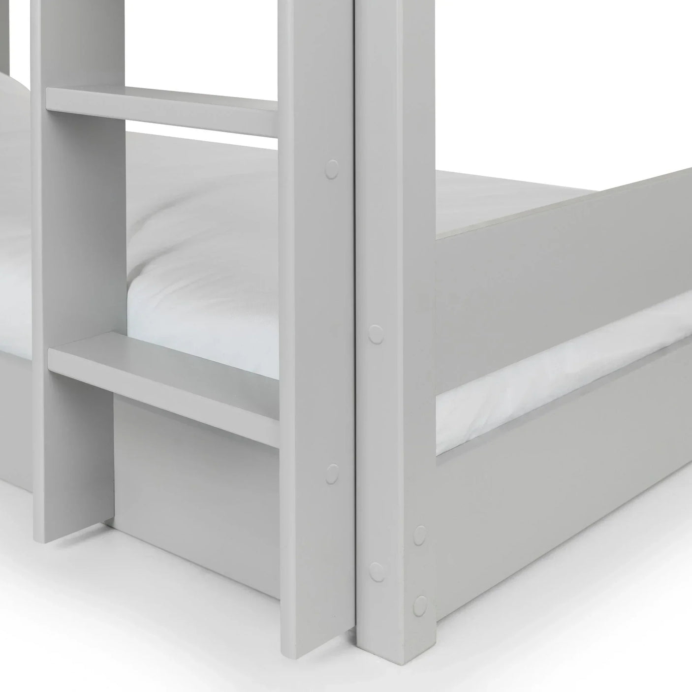 Close-up of light grey wooden bunk bed frame with ladder and white bedding