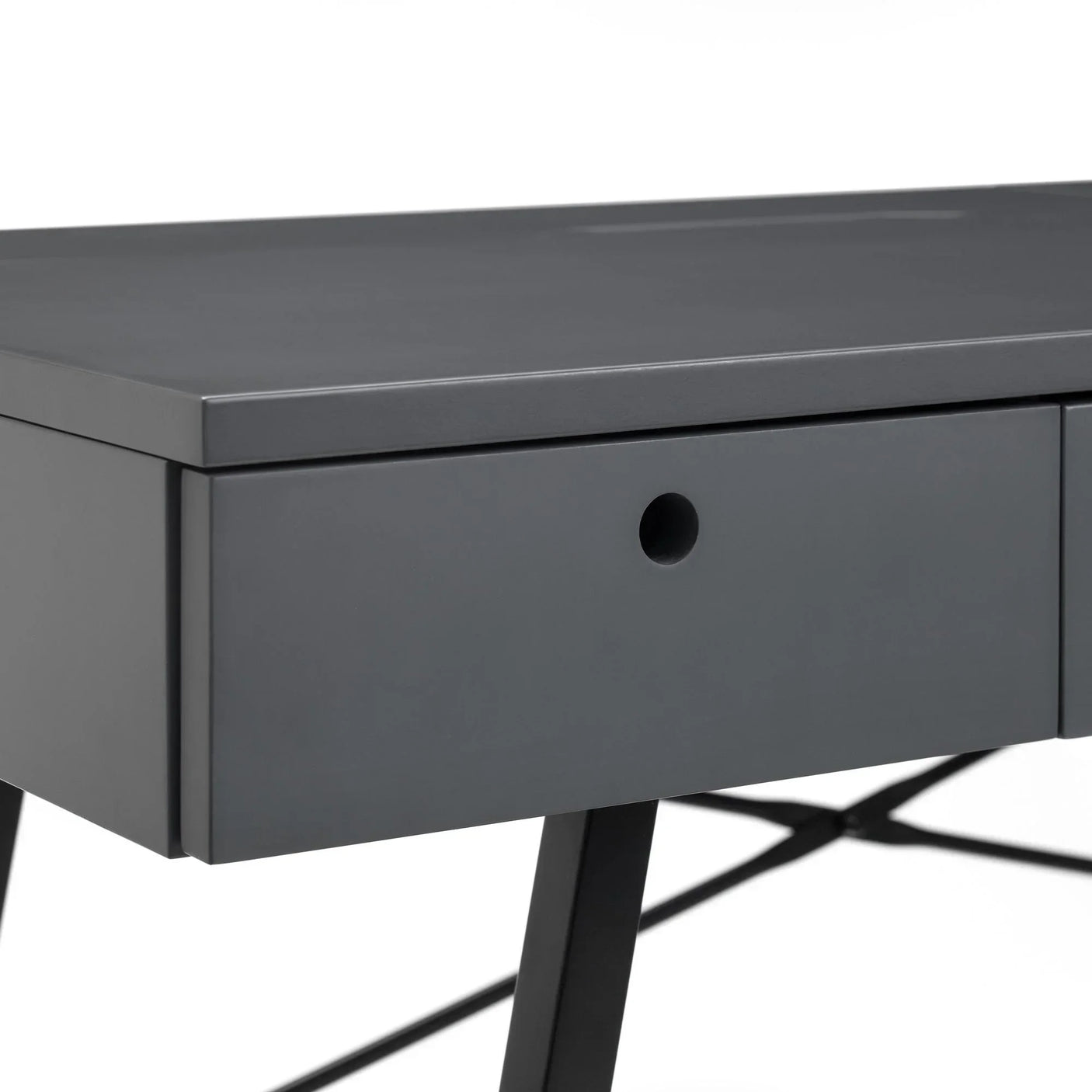 Grey desk with matte finish, close-up of drawer and black metal legs
