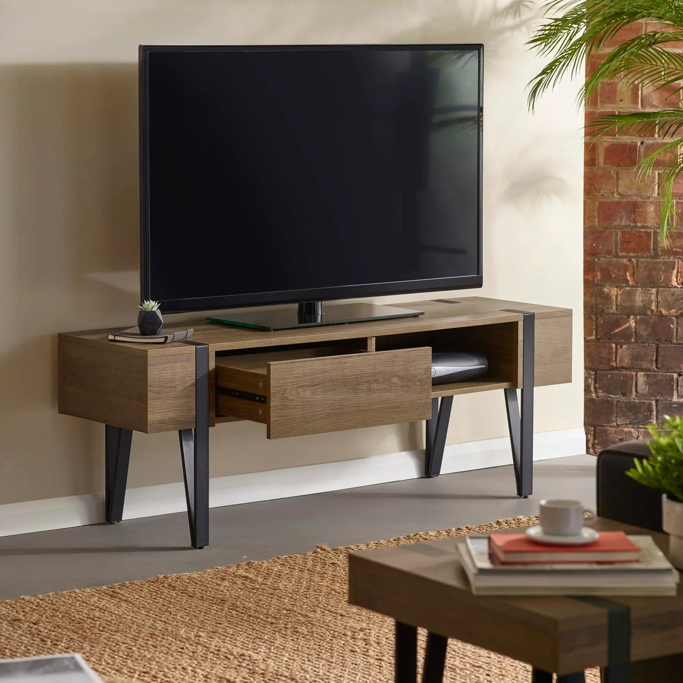 Wooden TV unit with black metal legs, open drawer and shelves in modern living room