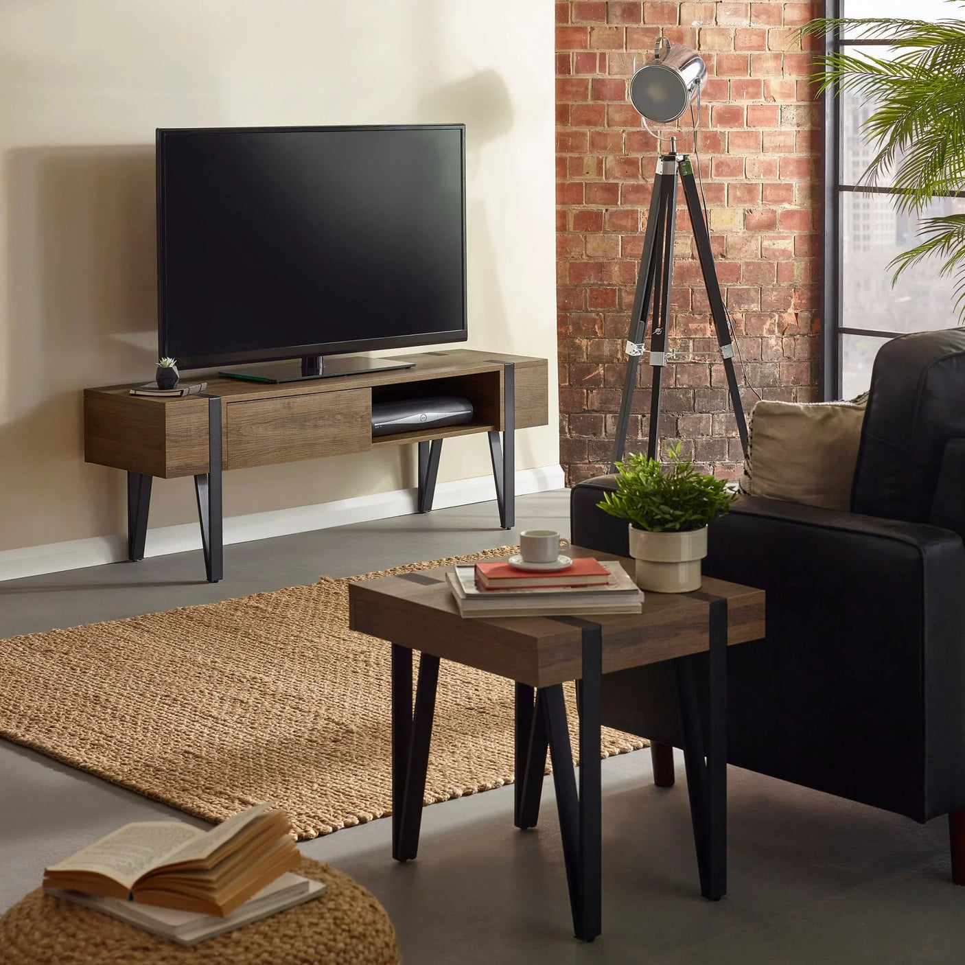 Oak effect TV unit with black metal legs and matching side table in modern living room