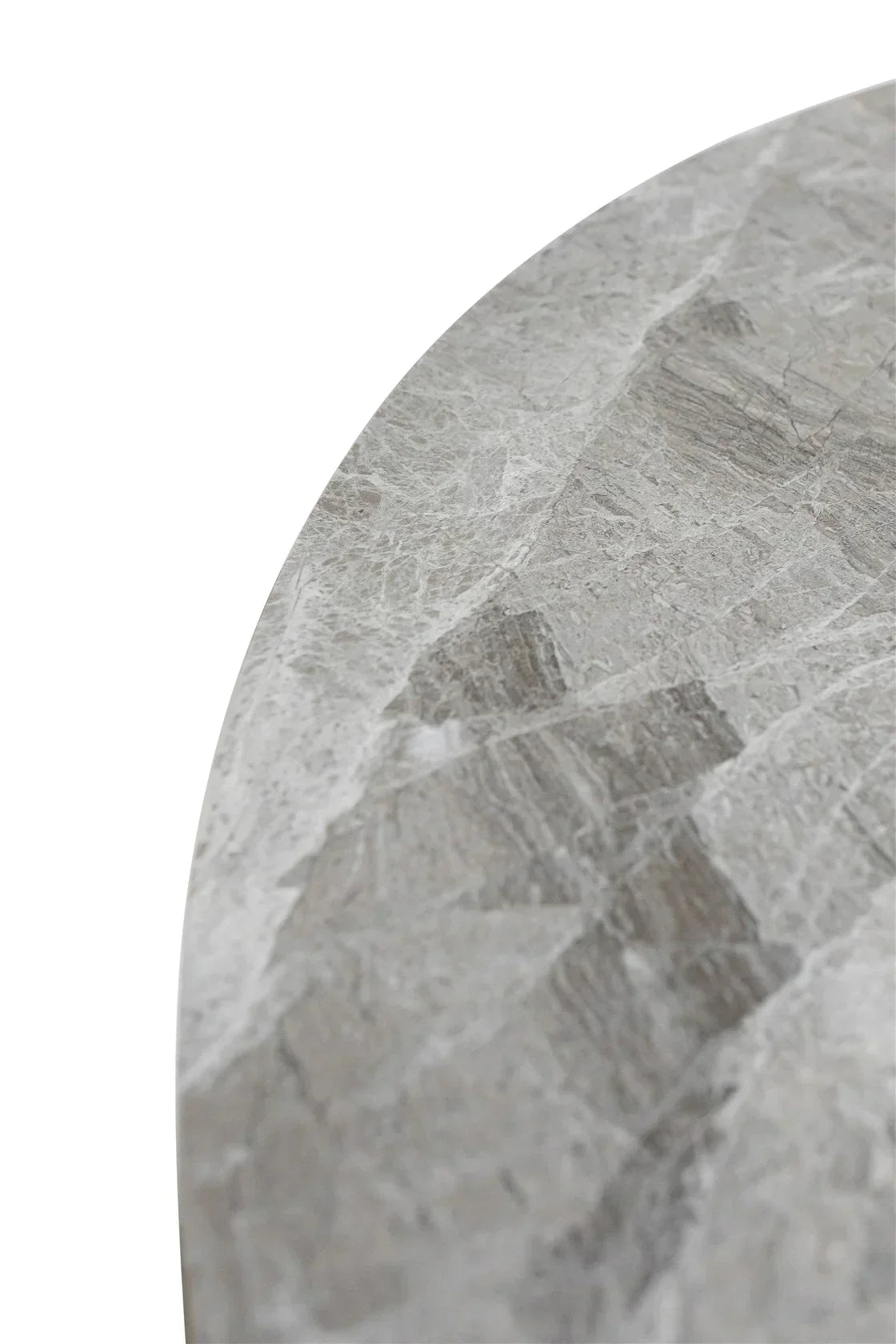 Close-up of round grey marble tabletop surface with natural stone veining pattern