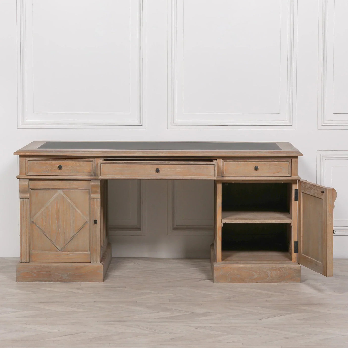Light wood office desk with black top, drawers, and open cabinet shelving