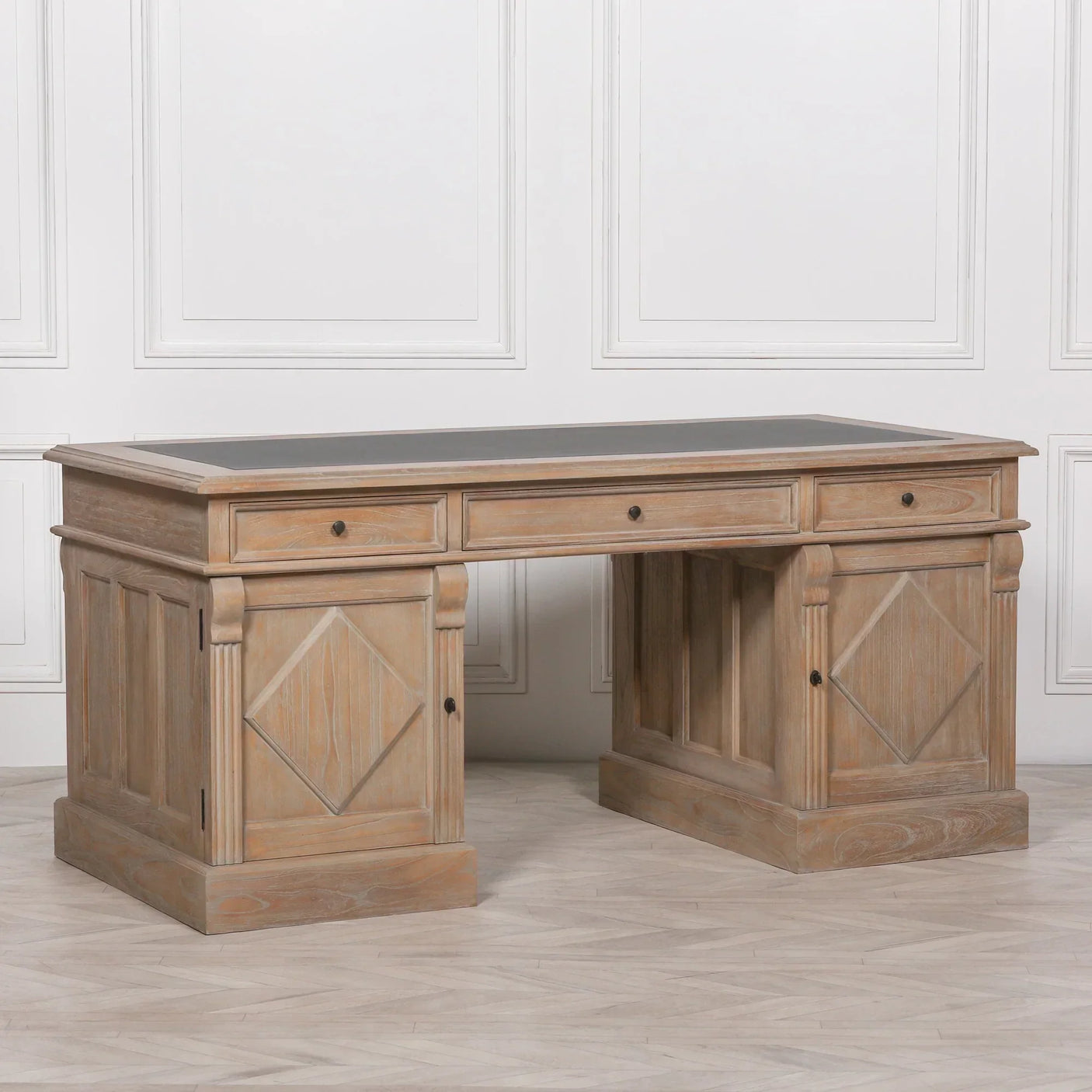 Rustic wooden office desk with panelled sides, three drawers, and dark top