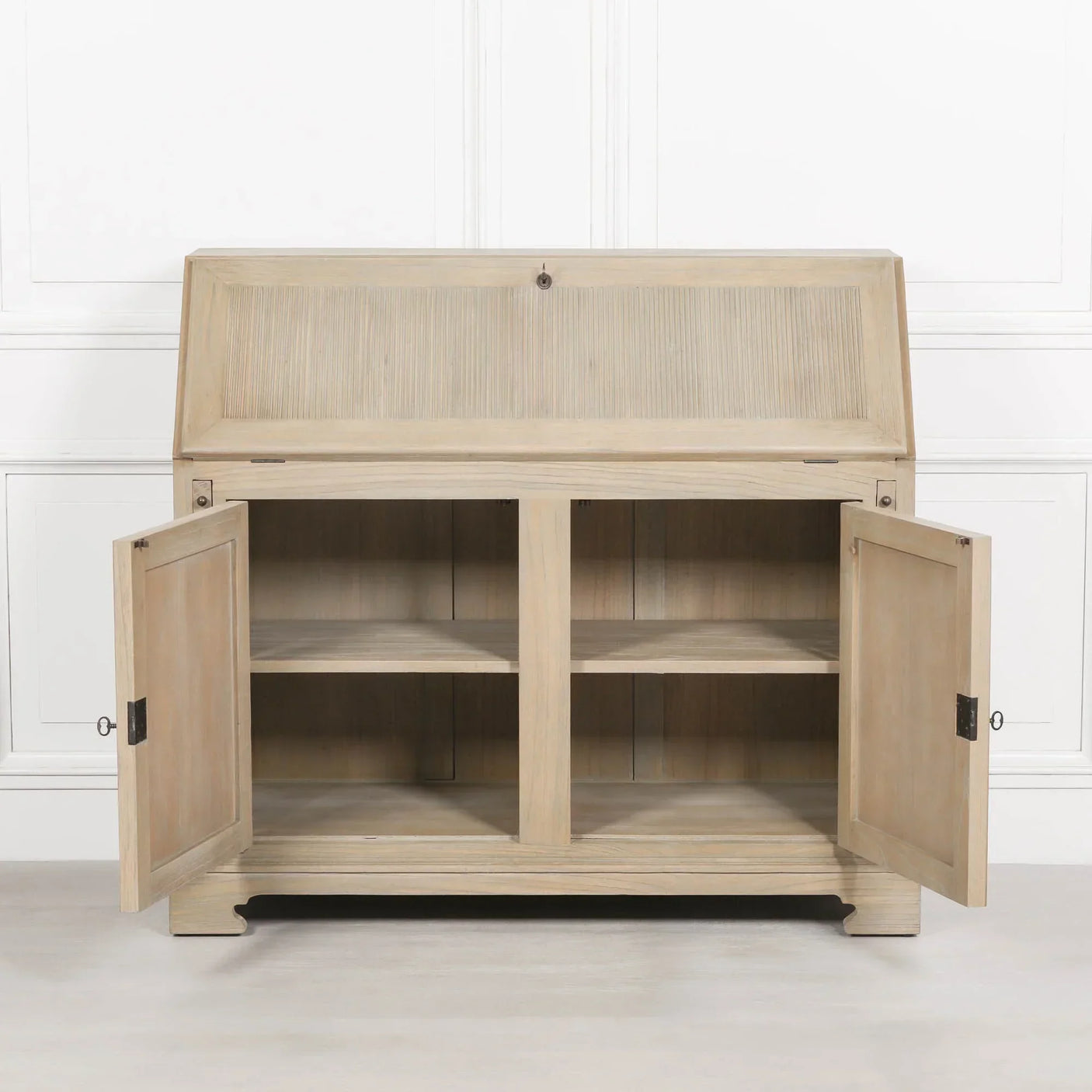 Light oak wooden storage cabinet with open doors and interior shelves against white wall