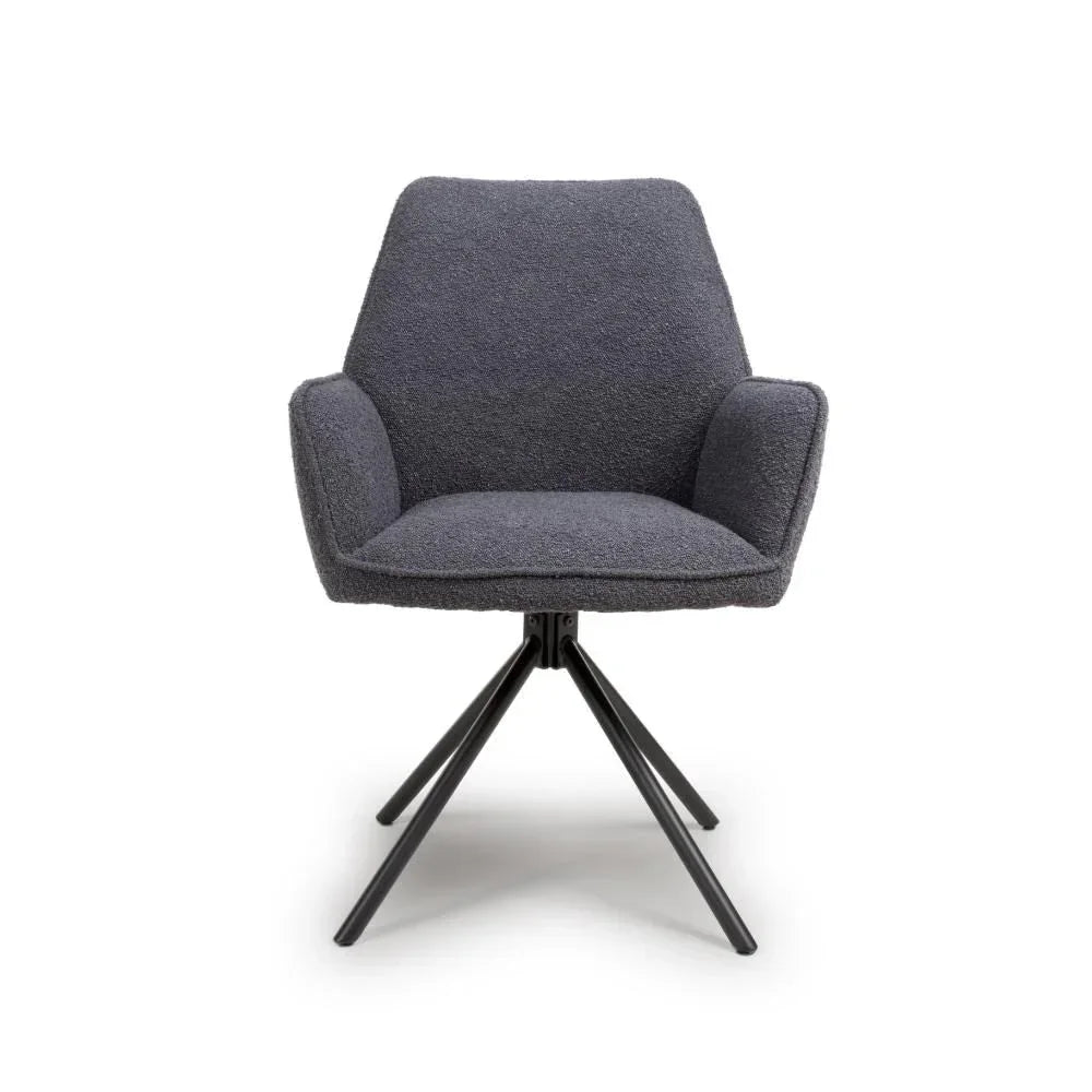 Charcoal fabric armchair with black metal legs, modern angular design, front view