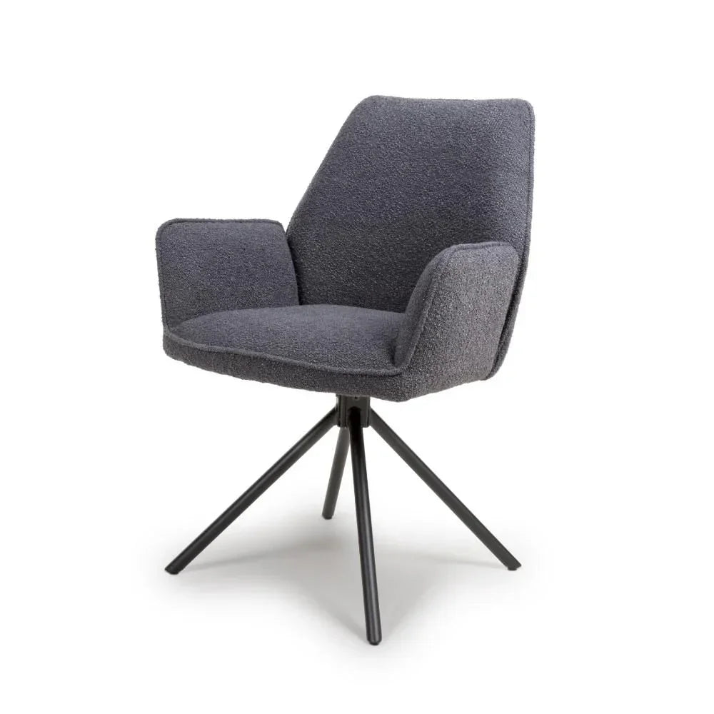 Grey fabric armchair with a swivel metal base and angled legs