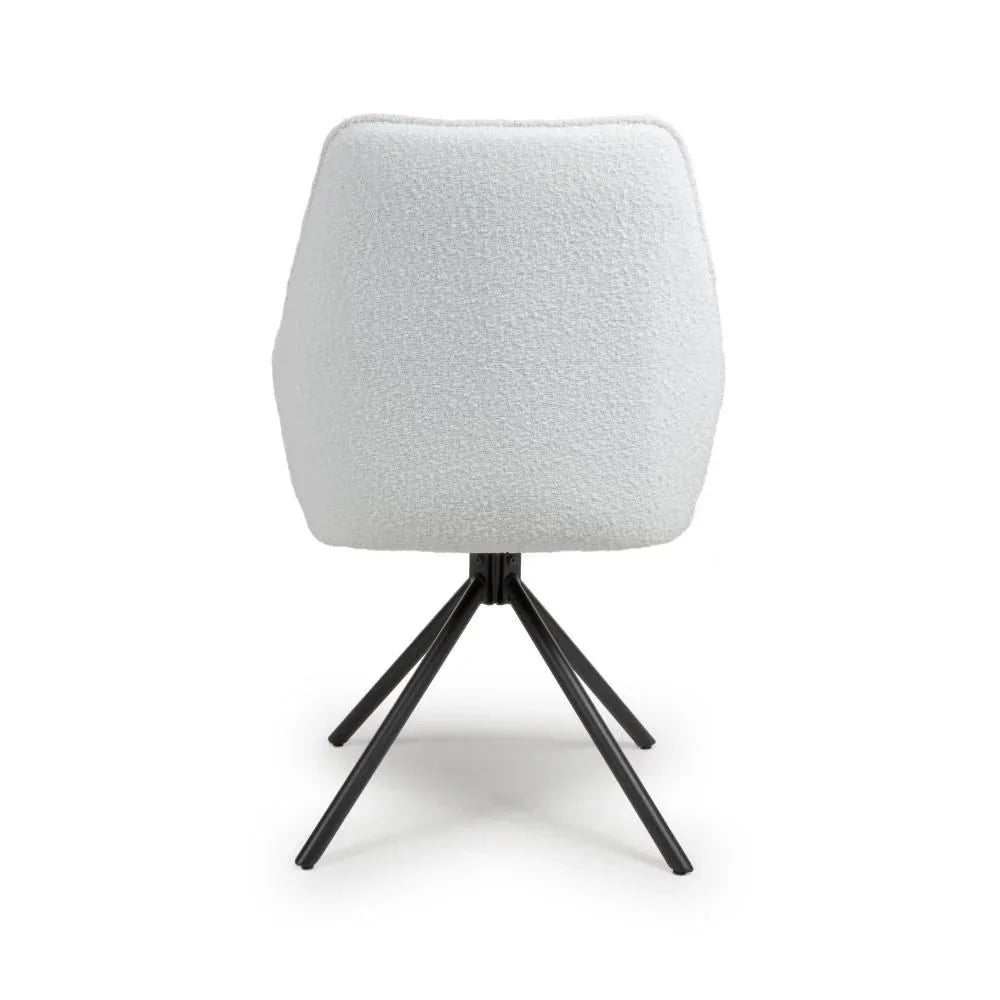 White boucle dining chair with black metal legs, rear view