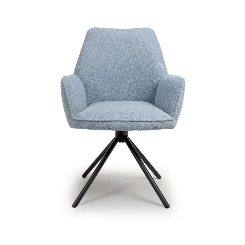 Light blue fabric accent chair with metal legs and armrests, front view