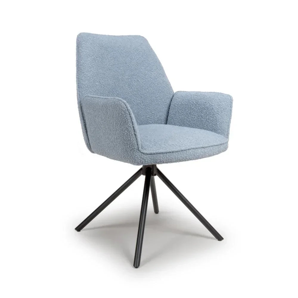 Light blue boucle accent chair with armrests and black angled metal legs