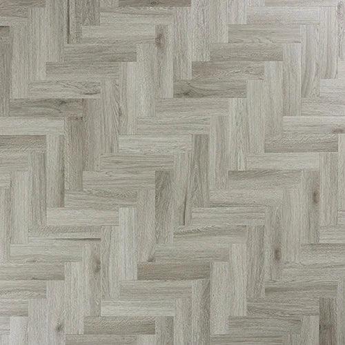 Urban grey herringbone laminate flooring with natural wood grain texture and light finish