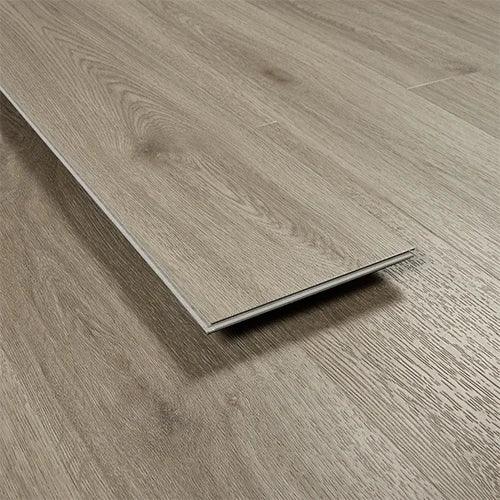 Urban grey wood effect laminate flooring plank with textured finish on flat surface