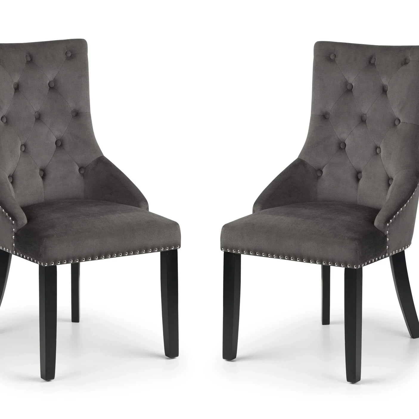 Pair of grey velvet dining chairs with button-tufted backs and black wooden legs