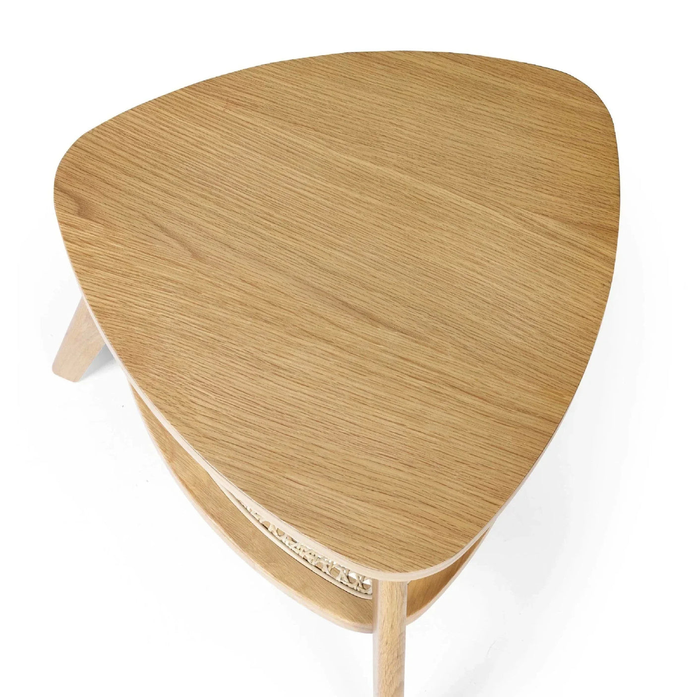 Oak wood coffee table with rounded triangular top and lower rattan shelf, top view