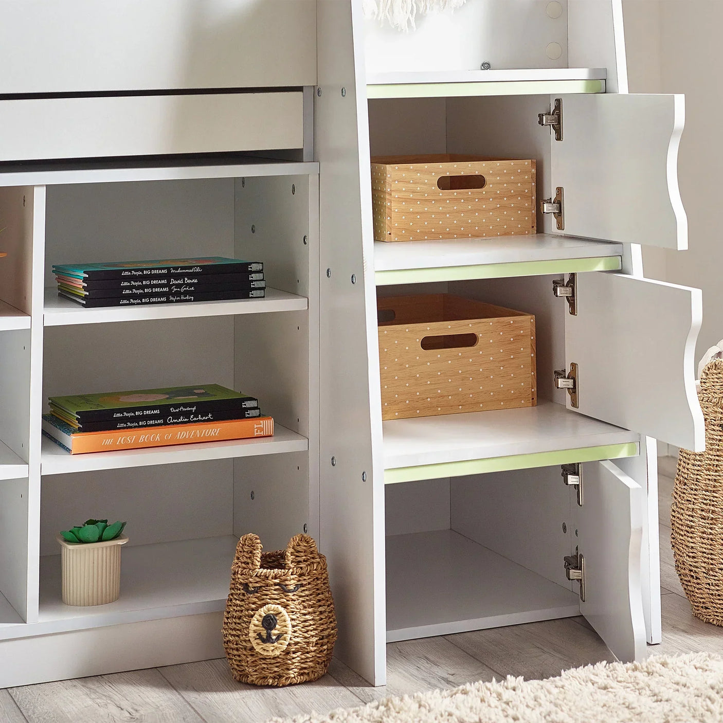 White midsleeper bed storage shelves with books, drawers, and wicker basket detail