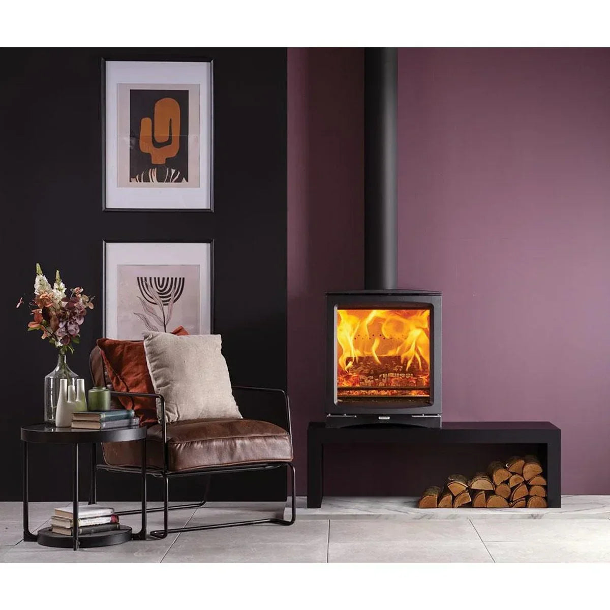 Contemporary living room with leather accent chair, round side table, and modern wood burning stove