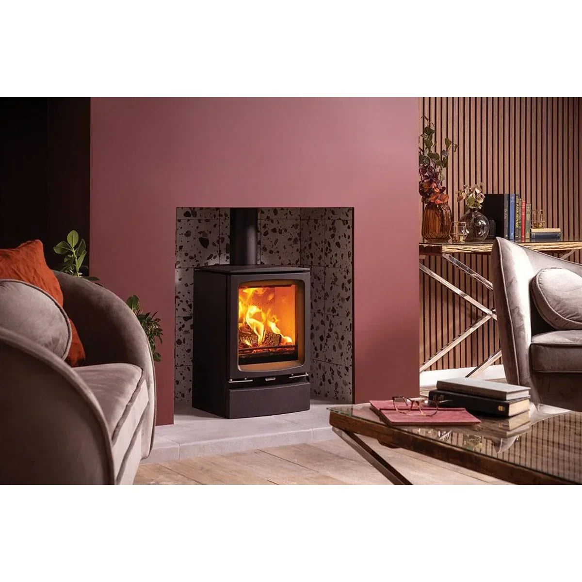 Modern wood burning stove with black frame in contemporary living room fireplace setting