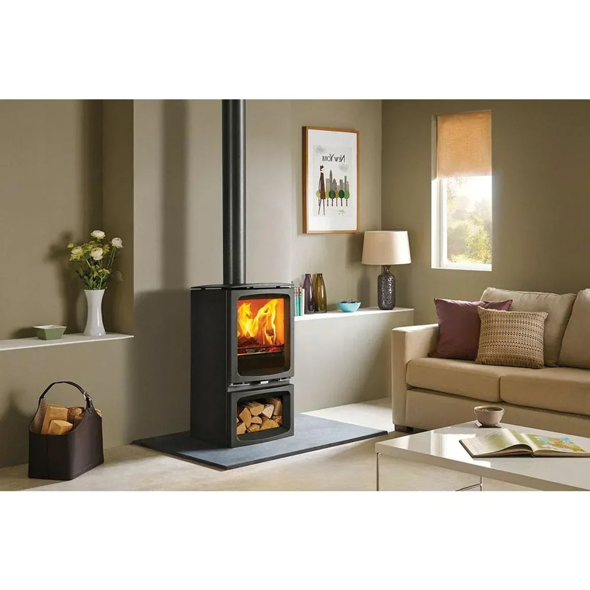 Black wood burning stove with glass door in modern living room next to beige sofa
