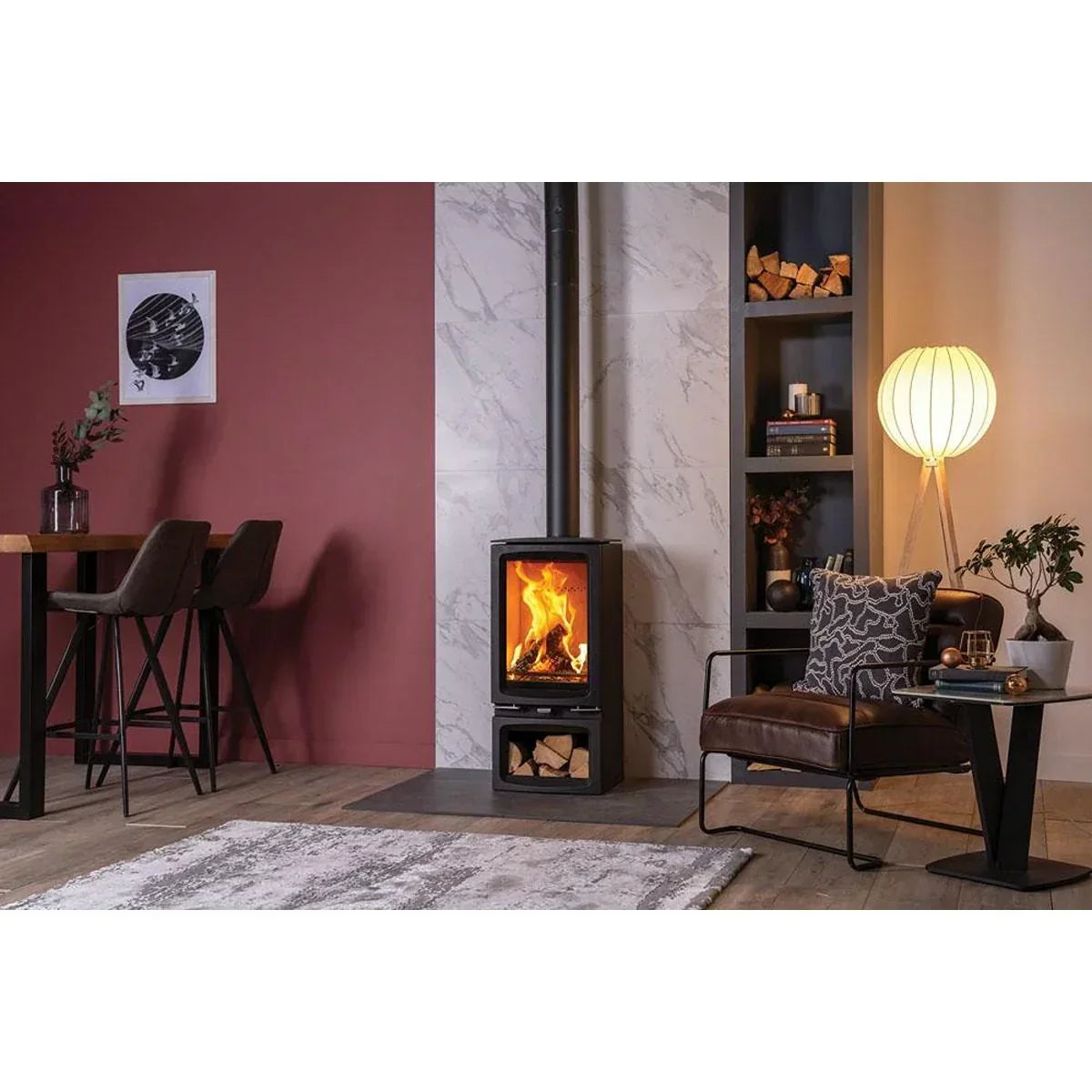 Modern wood burning stove in stylish living room with marble panel and cosy seating area